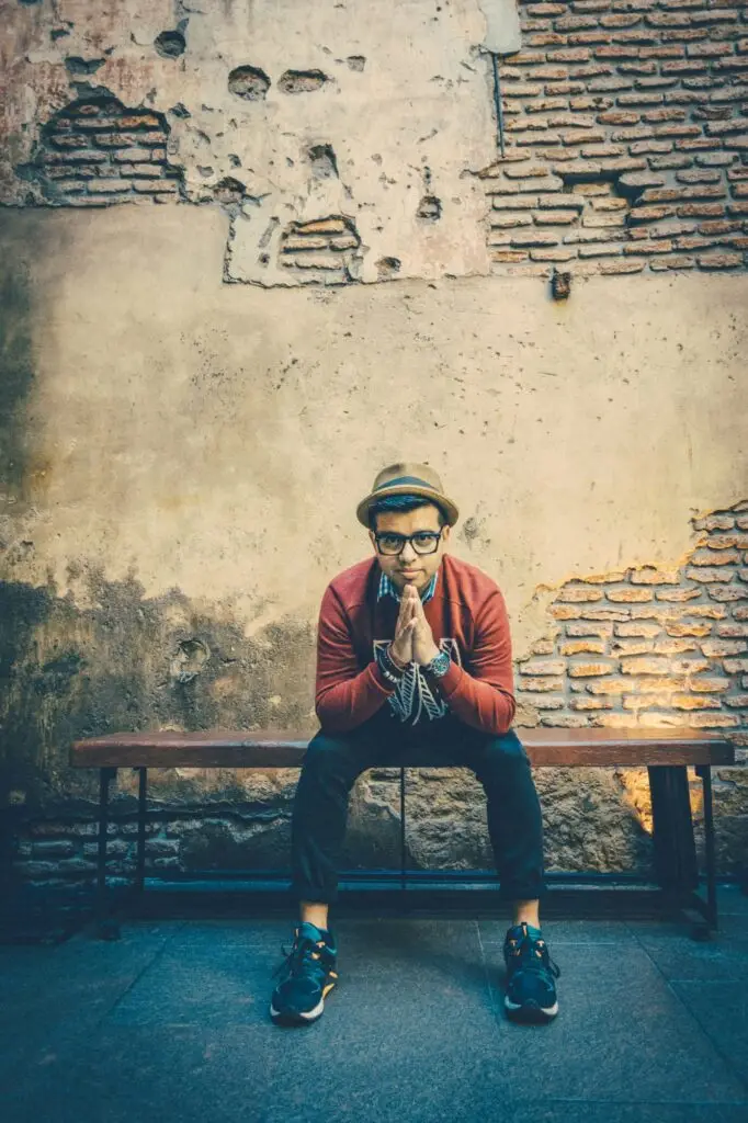 A Latino wearing a red sweater in Argentina