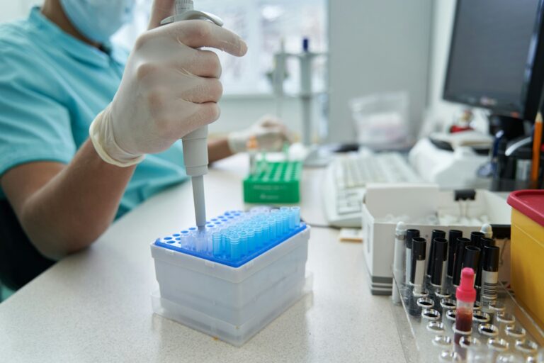 Male laborant doing research of blood samples