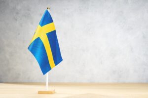 Sweden table flag on white textured wall